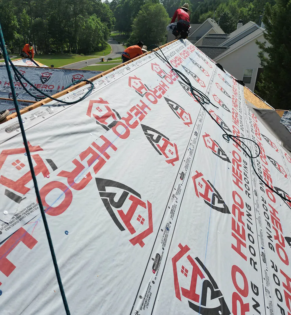 a photo of Hero Roofing company roofers on top of a roof
