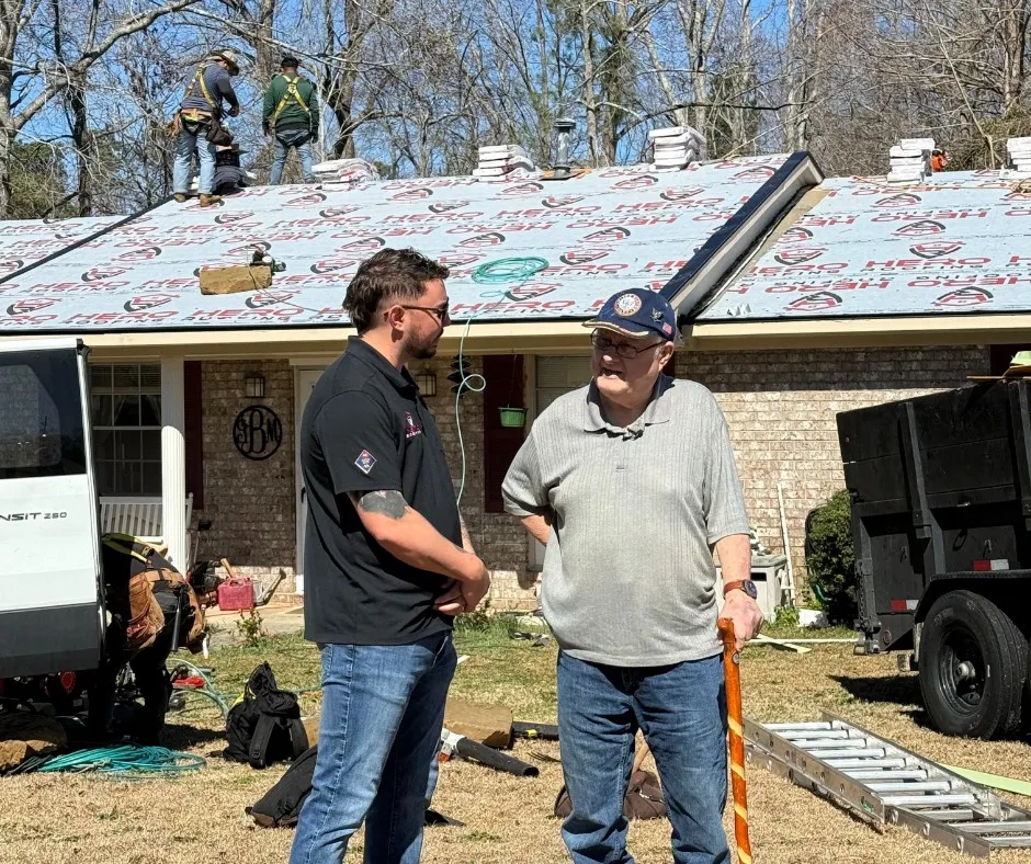 a photo of a Hero roofer with a veteran